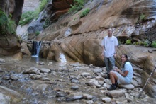 posing by the waterfall